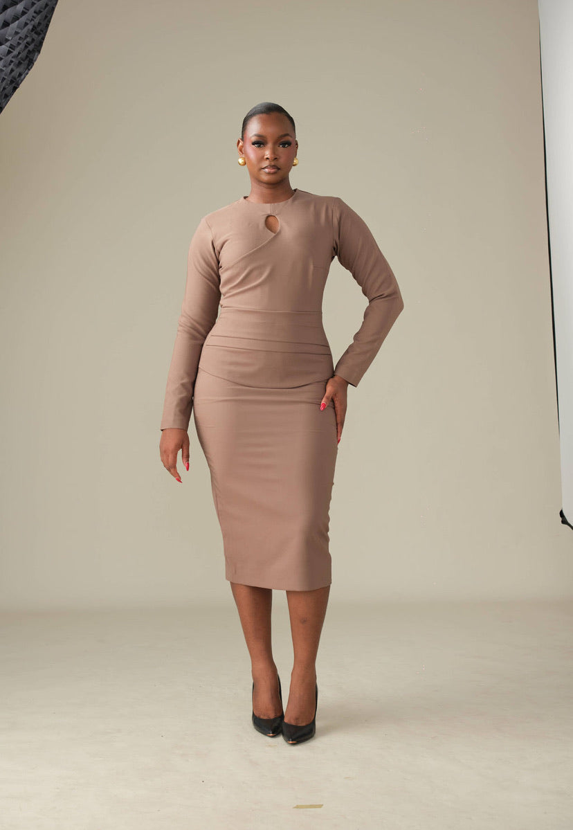 Woman wearing the kike dress in front of a grey bckdrop